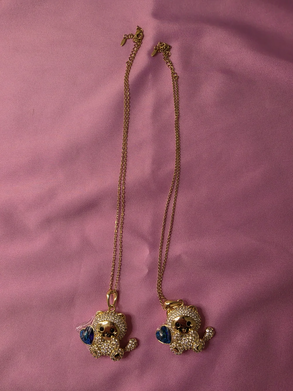 Gold-tone Crystal Puppy Pendant Necklace with Blue Heart Accent